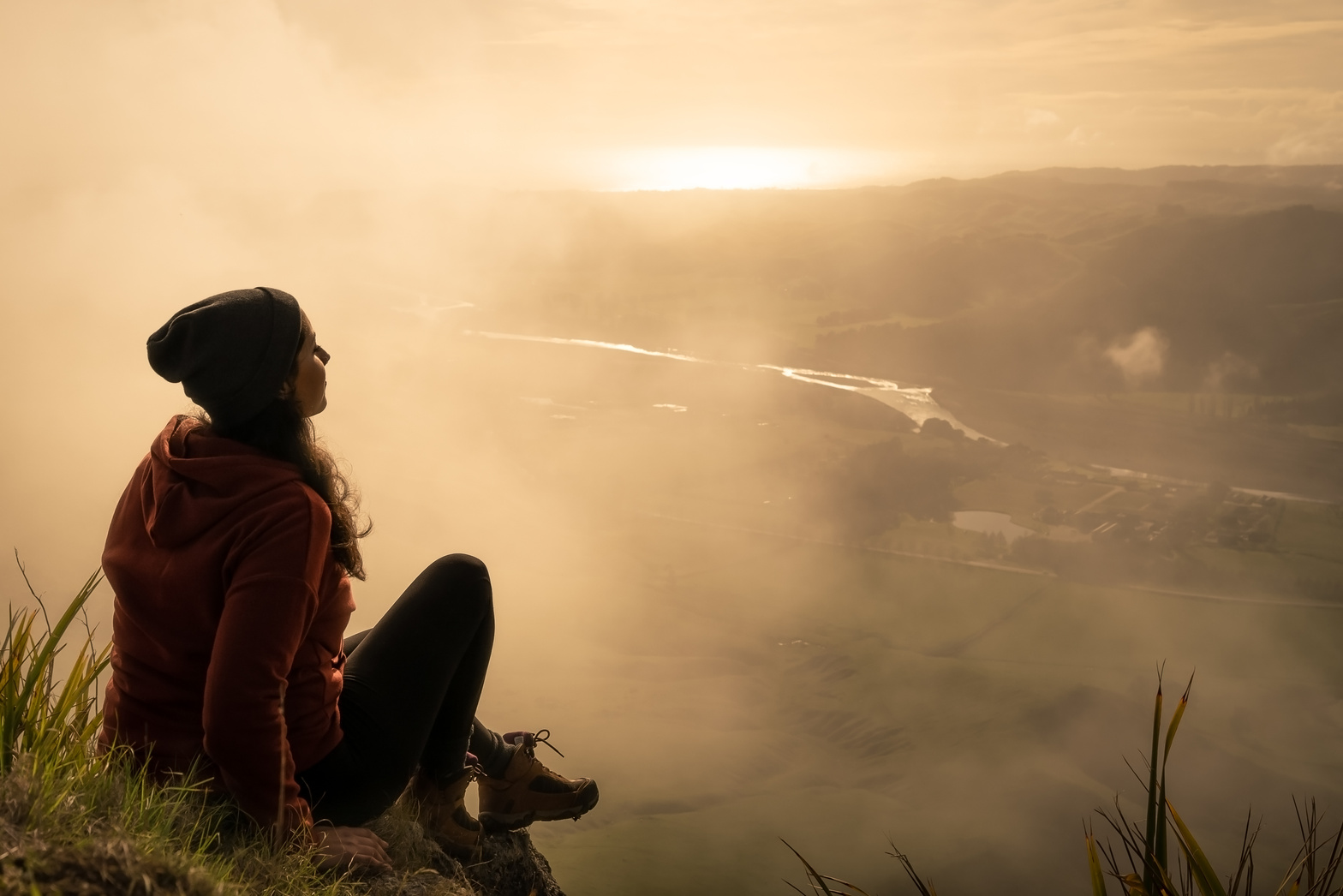 Woman Sitting on Top of Mountain 